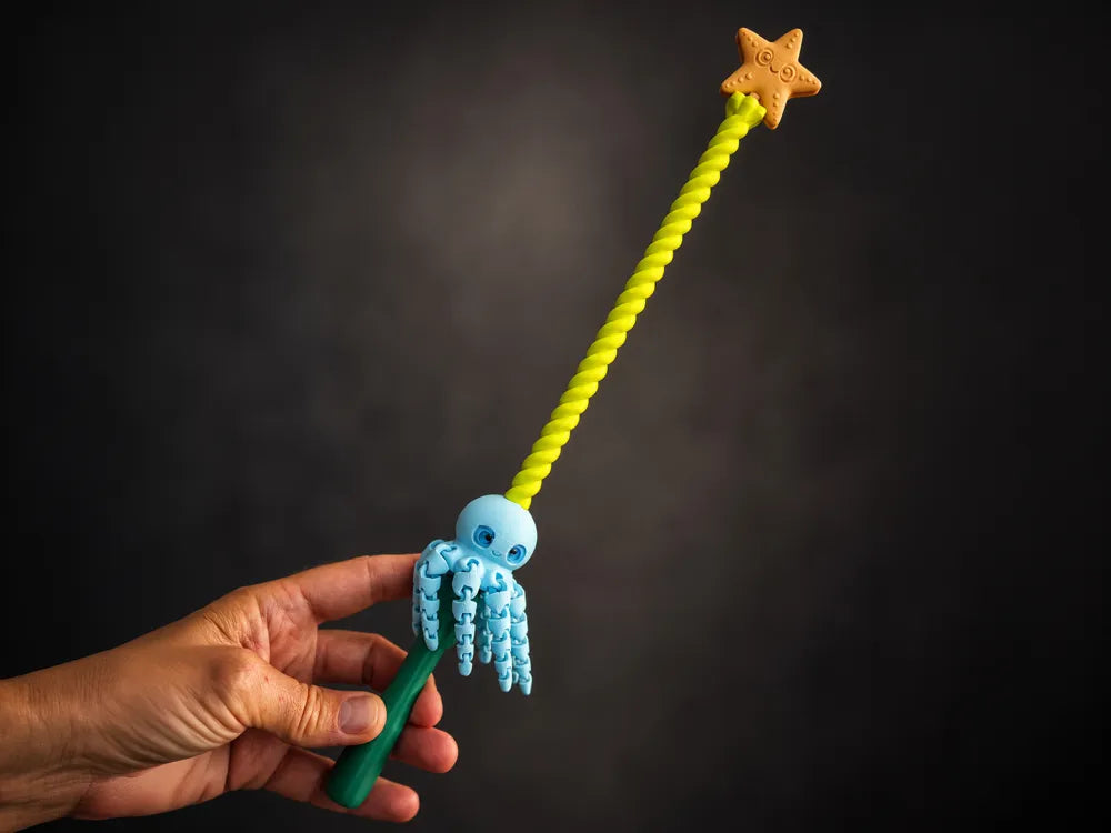 Spinning magic octopus wand with a blue octopus, green handle, lime spiral stick, and star topper