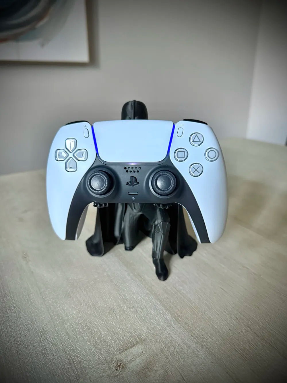 Dark lord helmet controller stand holding a controller